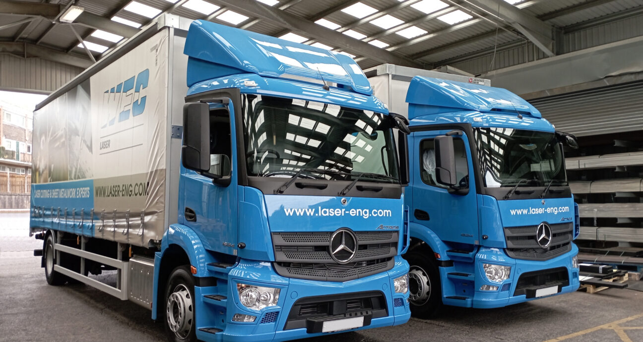 two laser engineering lorries, showing the logo and website address www.laser-eng.com